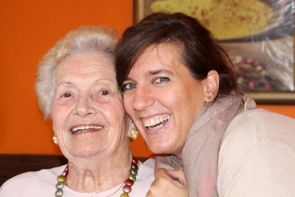 daughter and mother smiling for the camera